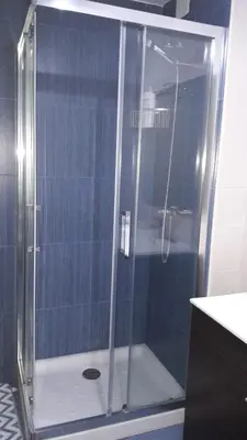 a shower with a glass door in a bathroom at Panoramico Playa de Altar I in Barreiros
