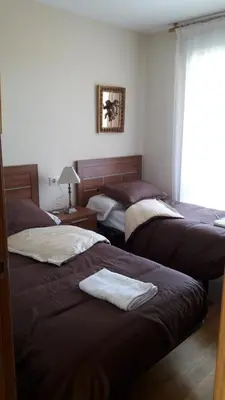 a bedroom with two beds and a window at Panoramico Playa de Altar II in Barreiros