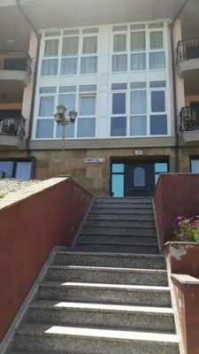 a set of stairs leading up to a building at Panoramico Playa de Altar II in Barreiros