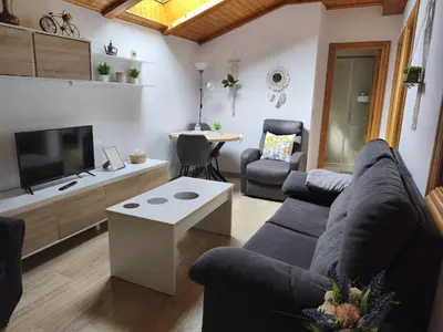 a living room with a couch and a table at Buen Camino Arzua in Arzúa