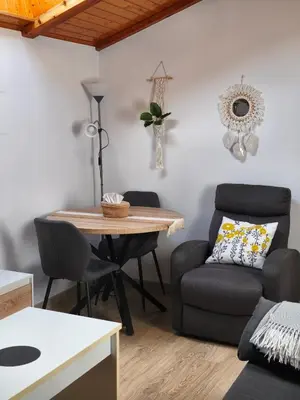 a room with a white wall with a mirror at Buen Camino Arzua in Arzúa