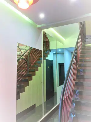 a staircase in a building with a glass wall at 4 Apartamentos de Autor in Lugo