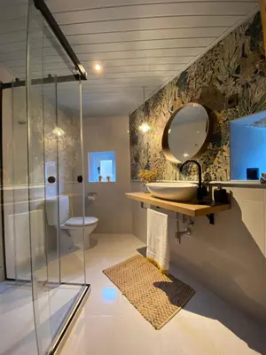 a bathroom with a shower and a sink and a mirror at Pena De Roca in Pontevedra