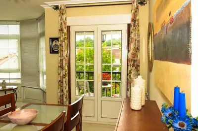 a dining room with a table and a glass door at Miranda VUT-PO-004637 in Caldas de Reis