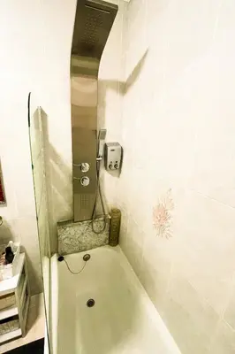 a bath tub in a bathroom with a shower at Miranda VUT-PO-004637 in Caldas de Reis