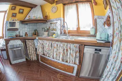 a kitchen with a sink and a stove at Villa Rural 