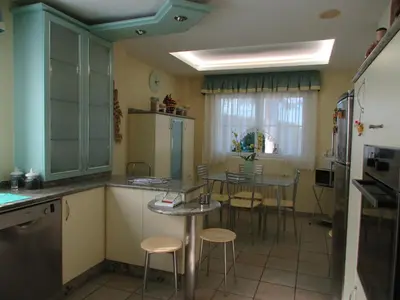 a kitchen with a table and chairs in it at Casa da Agra in A Coruña