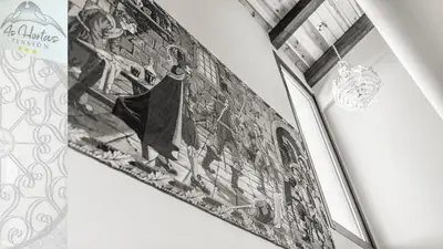 a black and white photo of a surfboard on a wall at Pensión As Hortas in Palas de Rei