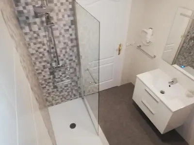 a bathroom with a shower and a sink at Residencia Compostela in Santiago de Compostela