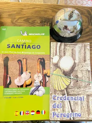 two magazines on a table with a bowl of food at SEÑOR OSO in Molinaseca