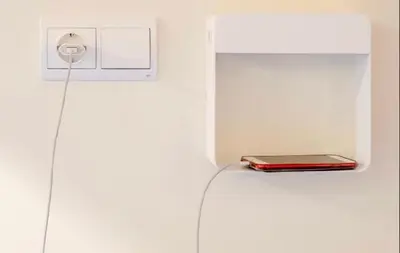 a red laptop sitting on a shelf in a wall at SEÑOR OSO in Molinaseca