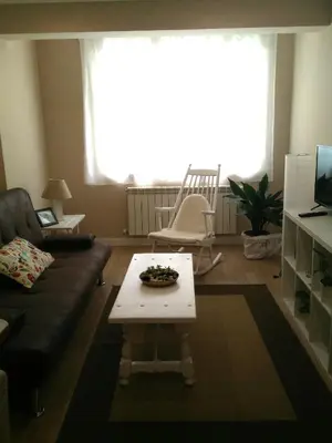a living room with a couch and a coffee table at Torre Center II in Santiago de Compostela