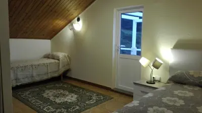 a small bedroom with a bed and a window at Casa Braña in Barreiros