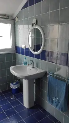 a bathroom with a sink and a mirror at Casa Braña in Barreiros