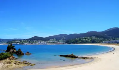a view of a beach with mountains in the background at Duerming Family Viveiro 3 Rooms in Viveiro