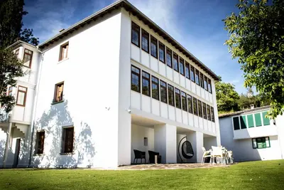 an exterior view of a white building at A Casa da Botica in Samos