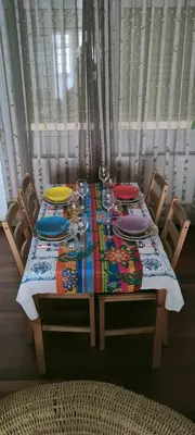 a dining room table with a colorful table cloth on it at Apartamento de 4 habitaciones en el Centro de Monforte in Monforte de Lemos