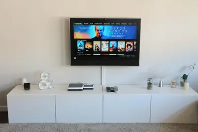 a white cabinet with a tv on a white wall at FOROPLAZA Porta San Pedro Pleno Centro Vistas Muralla in Lugo