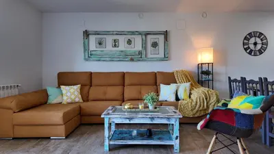 a living room with a couch and a table at PANTON RURAL Casa Do José in Pantón