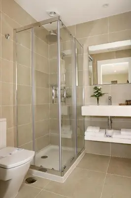 a bathroom with a shower and a toilet and a sink at VÍA XIX in Caldas de Reis