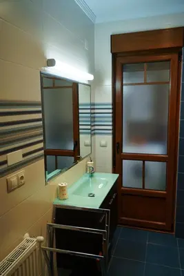 a bathroom with a sink and a mirror at EDIFICIO CINE MON in Burela de Cabo