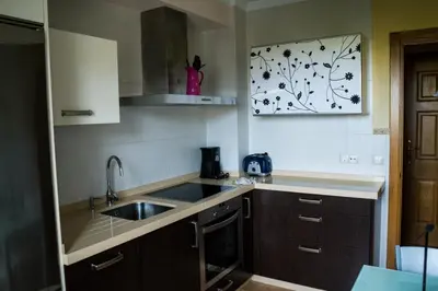 a kitchen with a sink and a counter top at EDIFICIO CINE MON in Burela de Cabo