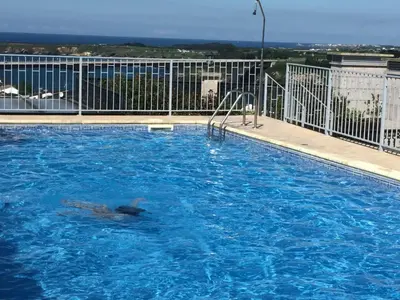 a swimming pool on top of a building at Ribadeo Centro in Ribadeo