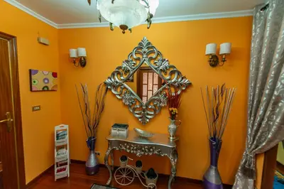 a room with a mirror and a table and vases at Apartamento Lemavos in Monforte de Lemos