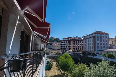 a balcony with a view of a city at Apartamento Lemavos in Monforte de Lemos