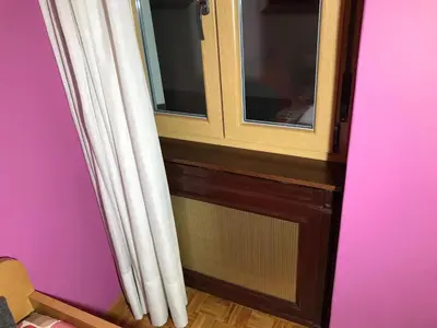 a cabinet with a window in a room at nice apartment Don Santiago in Santiago de Compostela