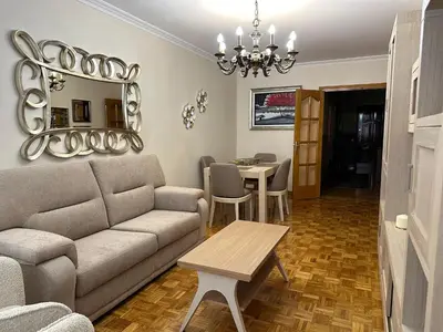 a living room with a couch and a table at nice apartment Don Santiago in Santiago de Compostela