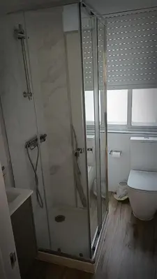 a bathroom with a shower and a toilet at La mesa del cocinero in Lugo