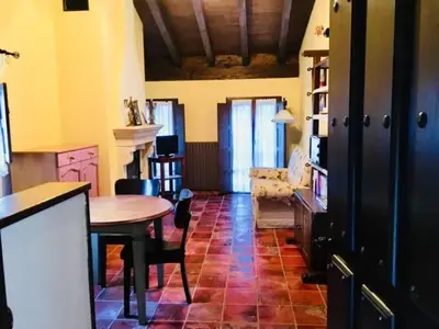 a living room with a table and a couch at Apartamentos Torre Villar in Villar de Vildas