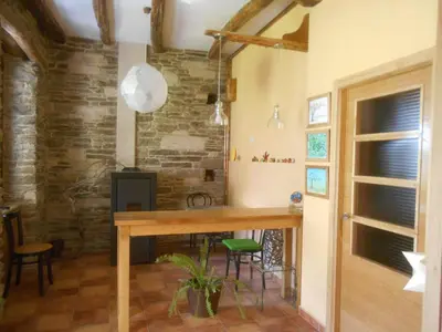 a kitchen with a wooden table in a room at XARDÍN DE ESTRELAS *** in Sarria
