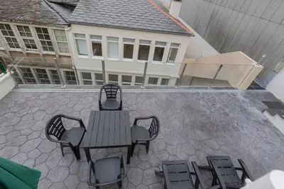 an overhead view of a patio with a table and chairs at Noray Apartamentos Viveiro in Viveiro