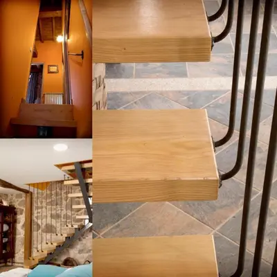 a staircase in a house with wood treads at Casa de Anamá in Entrecinsa