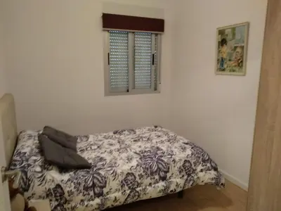 a bedroom with a bed in a room at APARTAMENTO EN EL CENTRO DE LALIN in Lalín