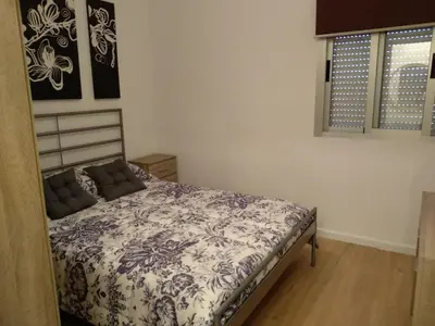 a bedroom with a bed in a room at APARTAMENTO EN EL CENTRO DE LALIN in Lalín