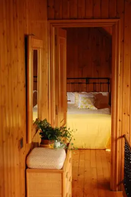 a bedroom with a bunk bed in a cabin at FINCA SALVADOR in Baralla