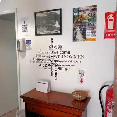 a room with a wall with writing on it at Pensión Fornos in Caldas de Reis