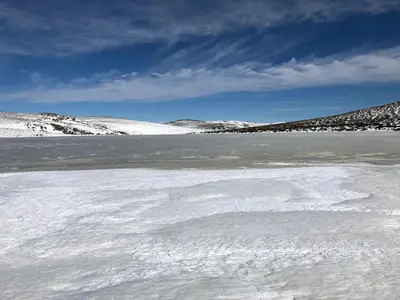 a large body of water with snow on it at Hotel gela in El Puente