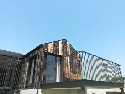 a building with a balcony on top of it at La Isla de Próspero in Tapia de Casariego