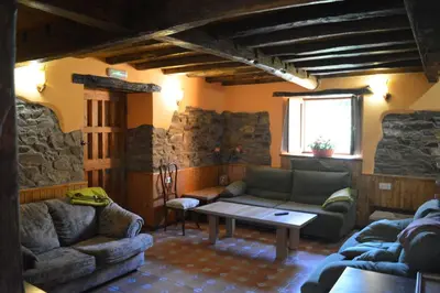 a living room with a couch and a table at Casa el Fanoso in Luarca