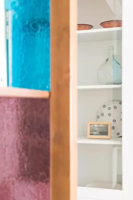 a shelf with colorful items on it at Apartamento Rosaleda in Melide