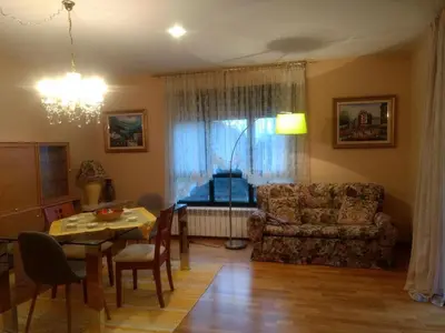 a living room with a table and a couch at En plena Ribera Sacra CasaCocó in Ferreira de Panton