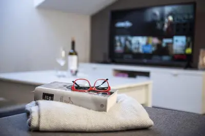 a pair of glasses sitting on top of a box at Apartamento Cuatro Caminos in Chantada