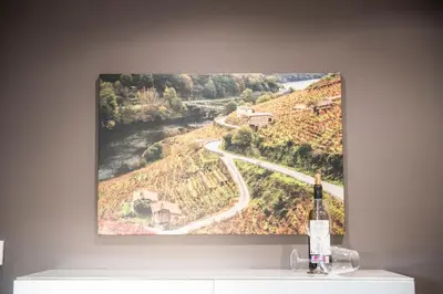 a painting of a wine bottle on a wall at Apartamento Cuatro Caminos in Chantada