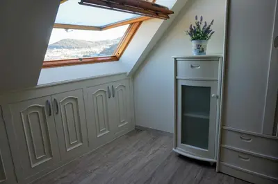 a skylight in a attic room with a window at Perla del Cantábrico in Vivero