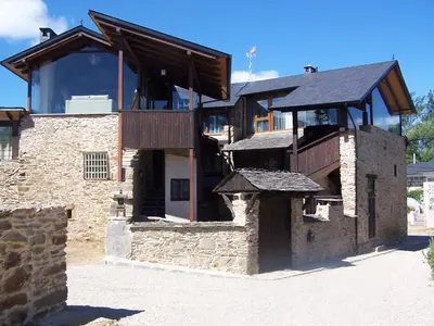 a large stone building with a roof at Alojamiento Luz de Hadas in Sampil
