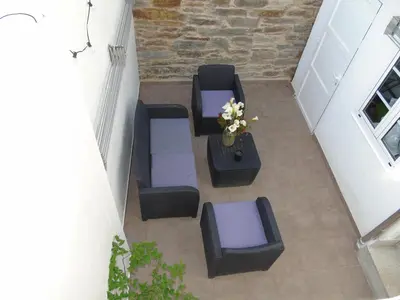 an overhead view of a patio with a table and chairs at Casa San Nicolás in Portomarin